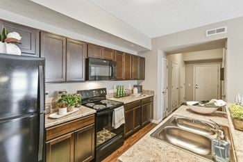 Brand new appliances including · above range microwave . Garbage disposal